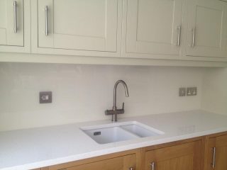 White coloured glass splashback