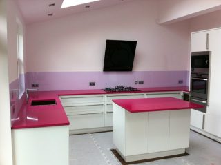 purple glass splashback & pink glass worktop